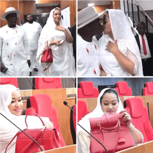 "A Love Unshaken: Natasha and Husband Share a Kiss at the Senate Amid Storms"